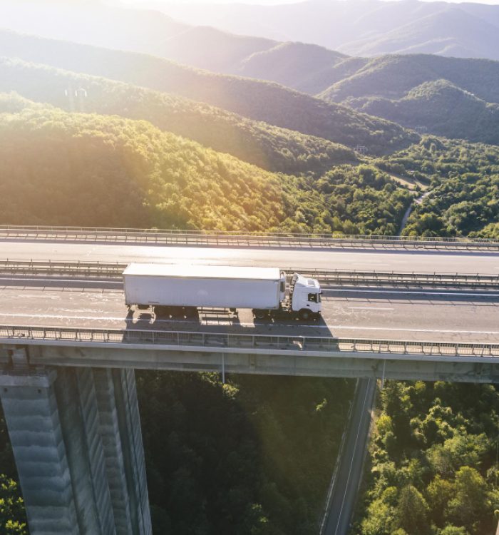 trucks-highway-mountain-sunset